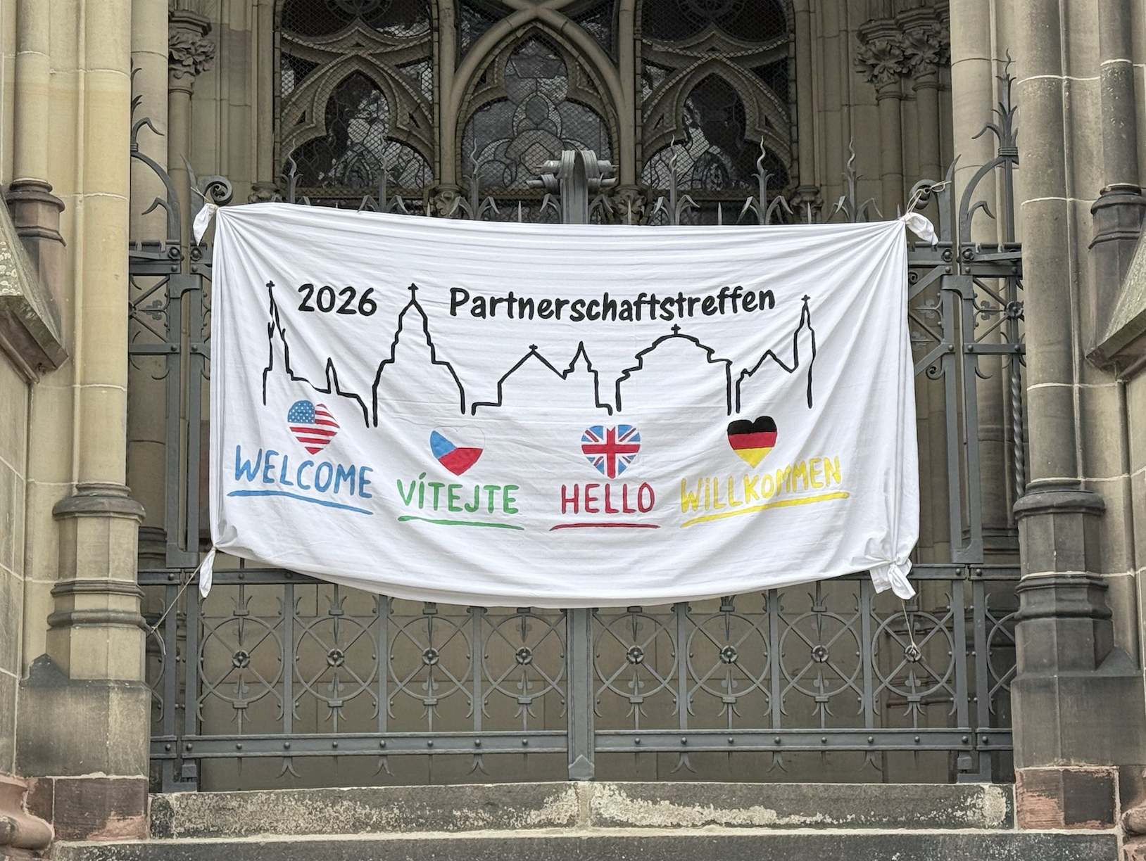 A colourful banner wecoming people to Speyer Partnership 2026